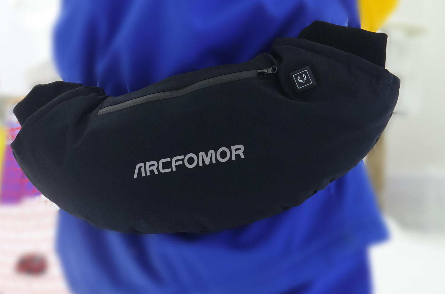 This image shows a skier with Arcfomor's heated hand warmers, which provide the skier with unparalleled warmth