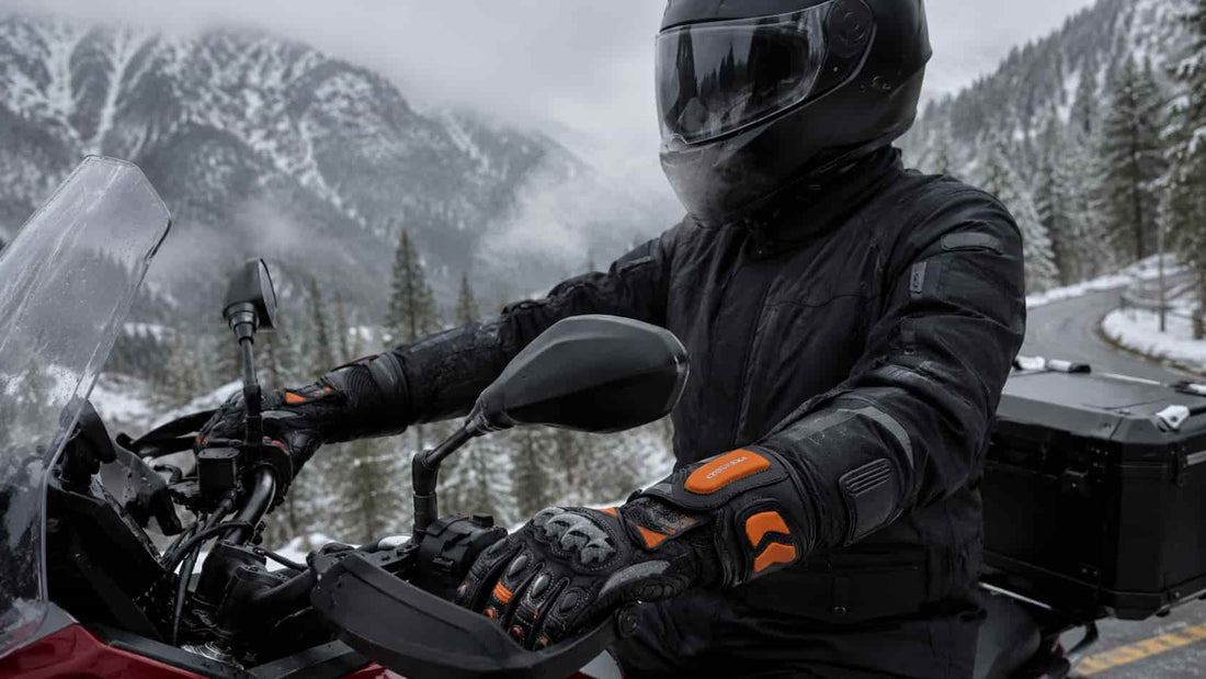 Motorcyclist wearing black Arcfomor heated motorcycle gloves in cold weather