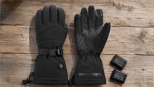 WinterGlow heated gloves and two removable batteries arranged for a condition and safety inspection