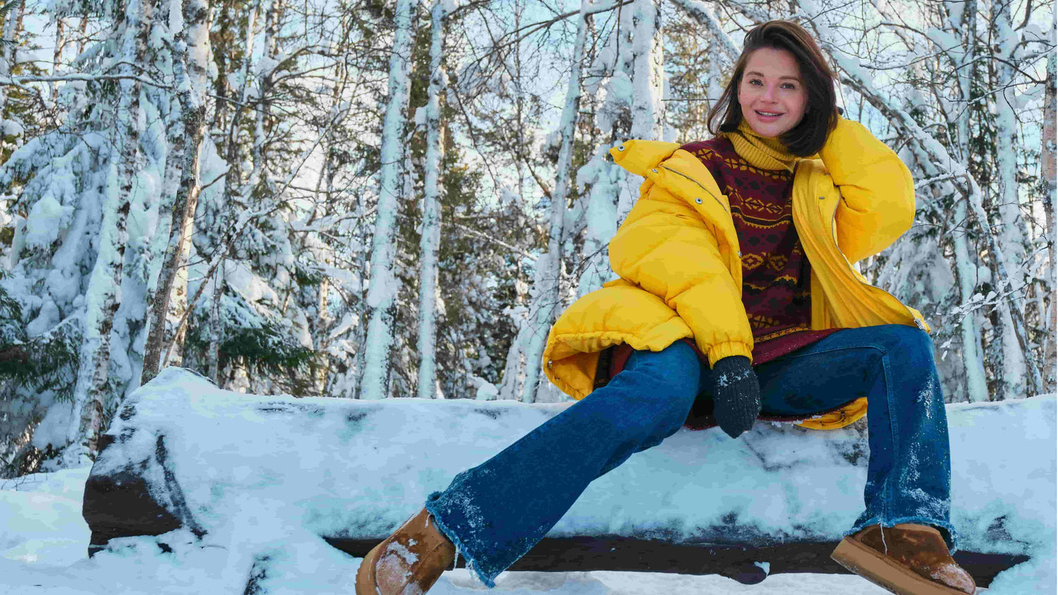 A beautiful woman wearing Arcformor Spider Silk gloves no longer has to worry about her hands getting cold in the winter snow.