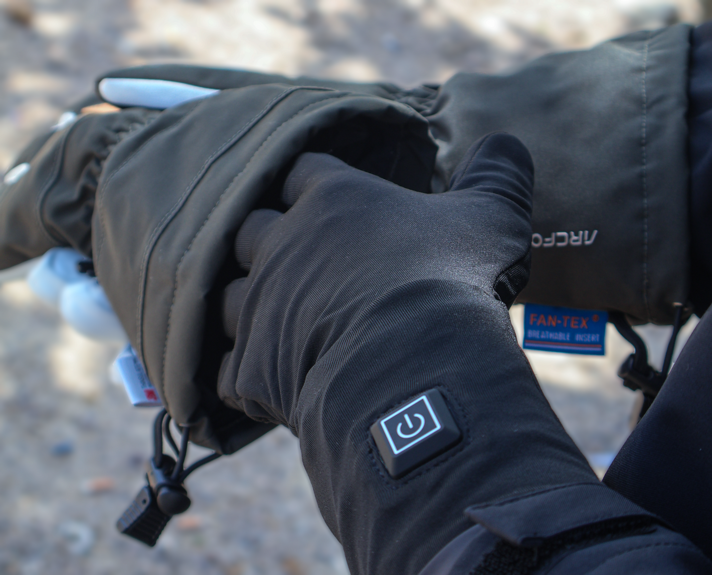 A man wears Yellowstone Gentleman's Shell Gloves in cold weather along with Dragonfly Lined Heated Gloves.