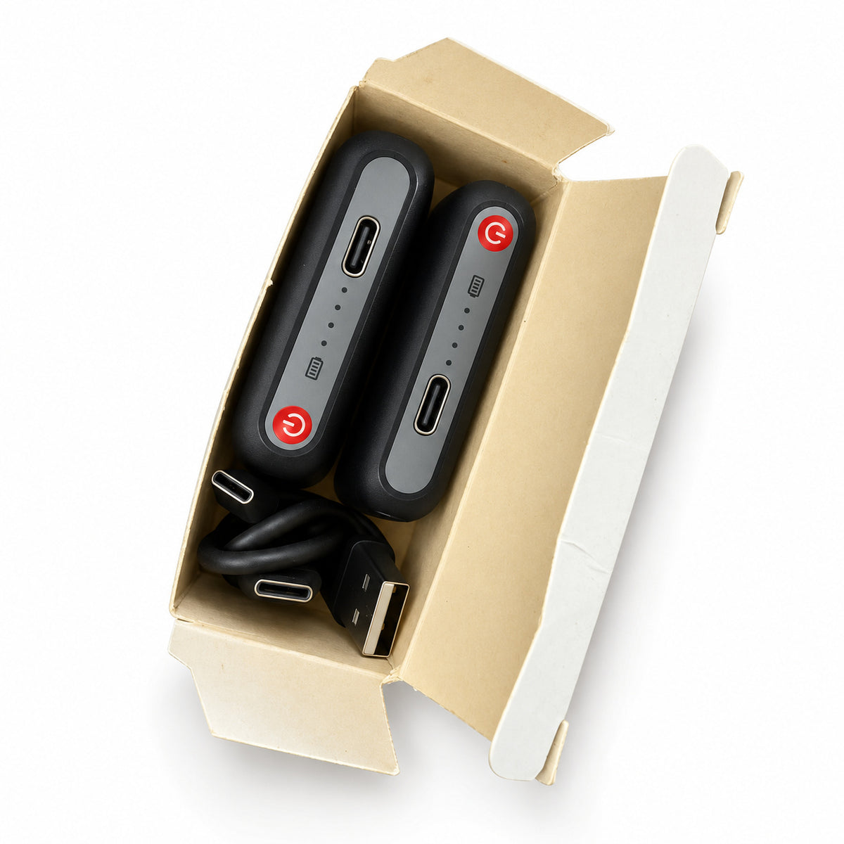 Two Dragonfly 5V batteries and a USB-A to dual USB-C charging cable in their open carton on a clean white background.