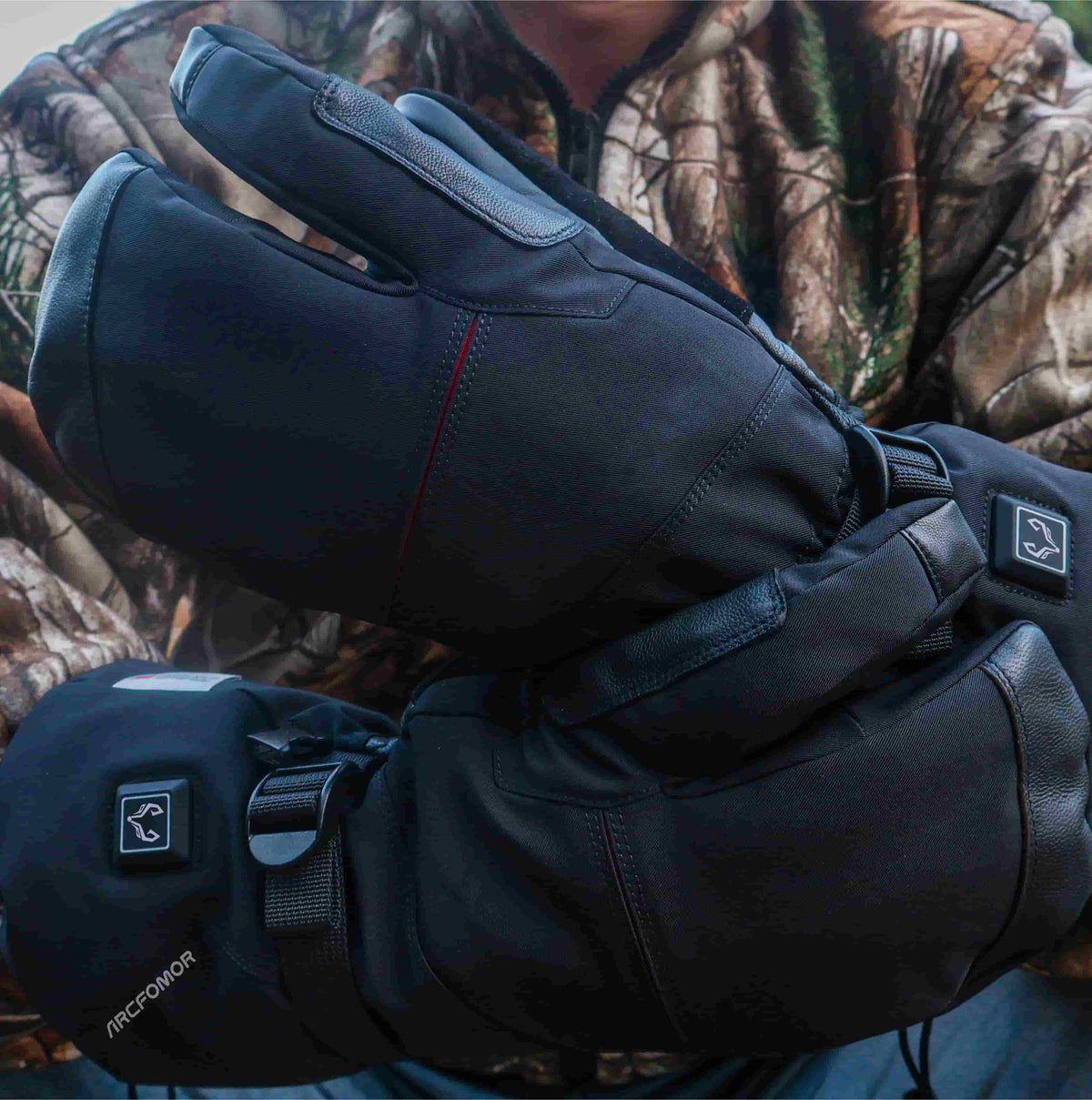 Close-up of Crab Claw 3-finger heated lobster gloves during outdoor use