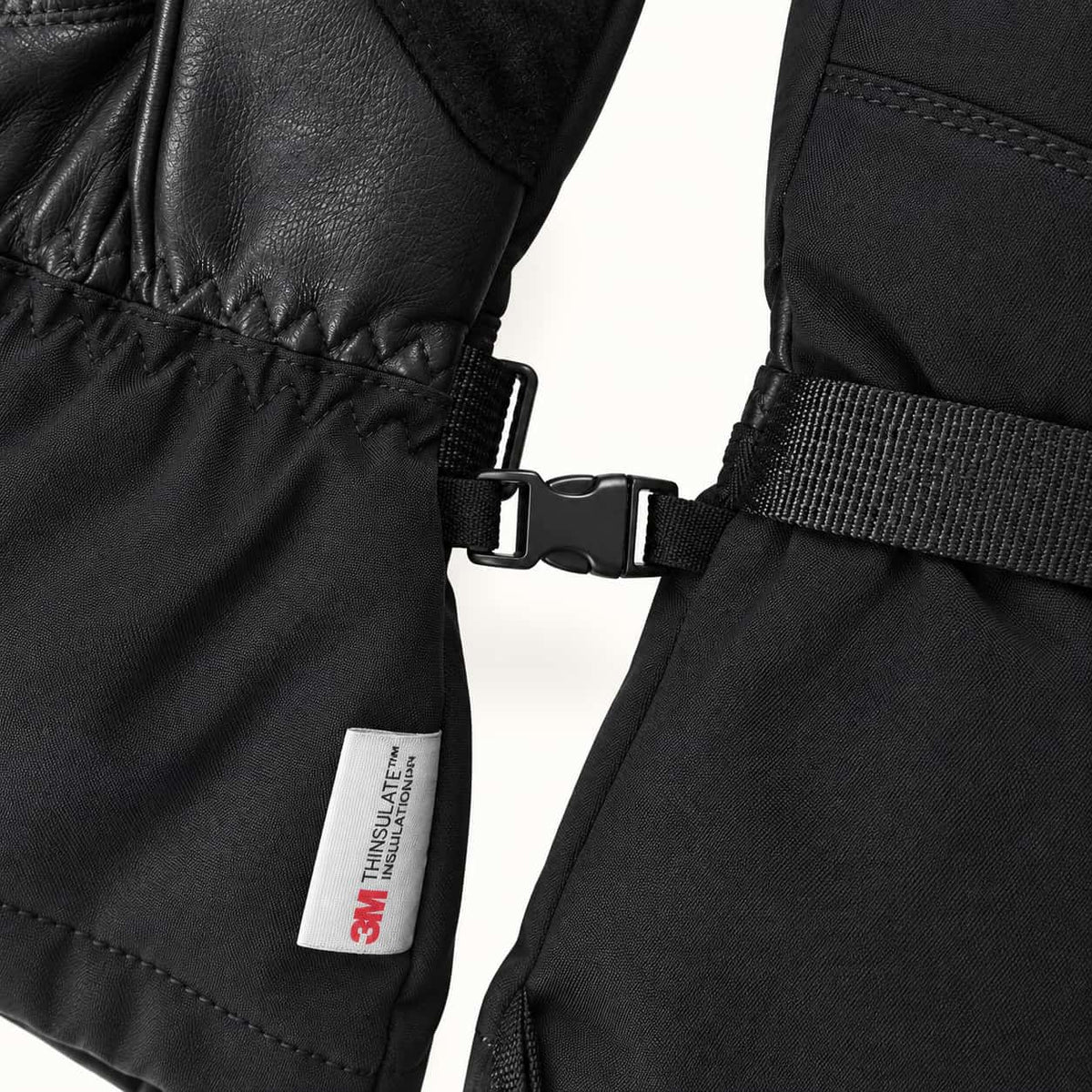 Pairing clip joining two Crab Leg gloves, with woven cuffs and a sewn 3M Thinsulate label.