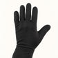 Back view of a black Dragonfly heated glove liner, showing the slim fabric construction and wrist seam.