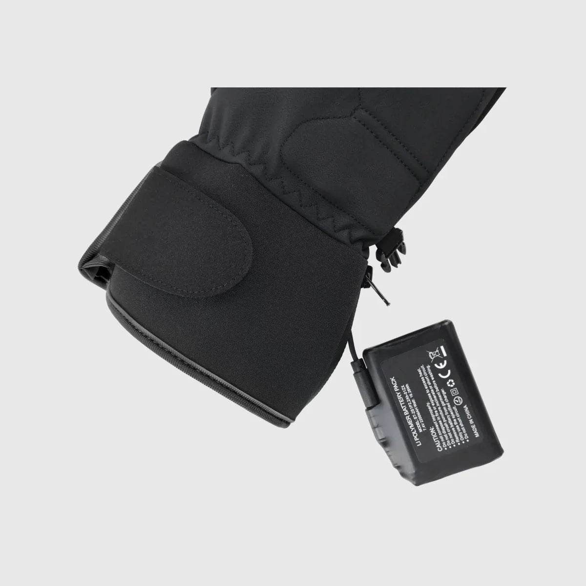 Ember 2.0 heated glove connected to its 7.4V 3000mAh wrist battery