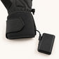 Ember 2.0 glove connected to a black rechargeable battery by a cable emerging from the side cuff pocket.