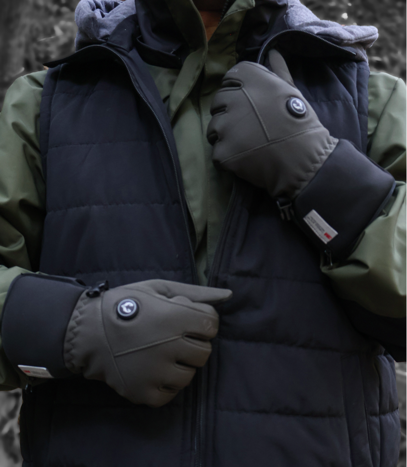 Person wearing Ember 2.0 heated gloves with a winter jacket outdoors