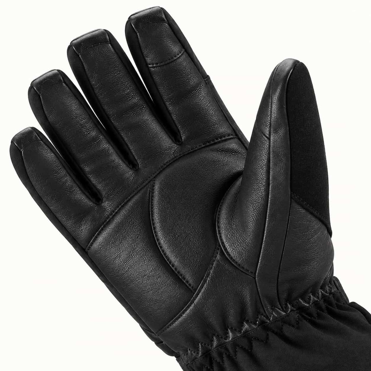 Close-up of the Helm glove's black goatskin palm, thumb panel and softly curved fingers, showing leather grain and stitching.