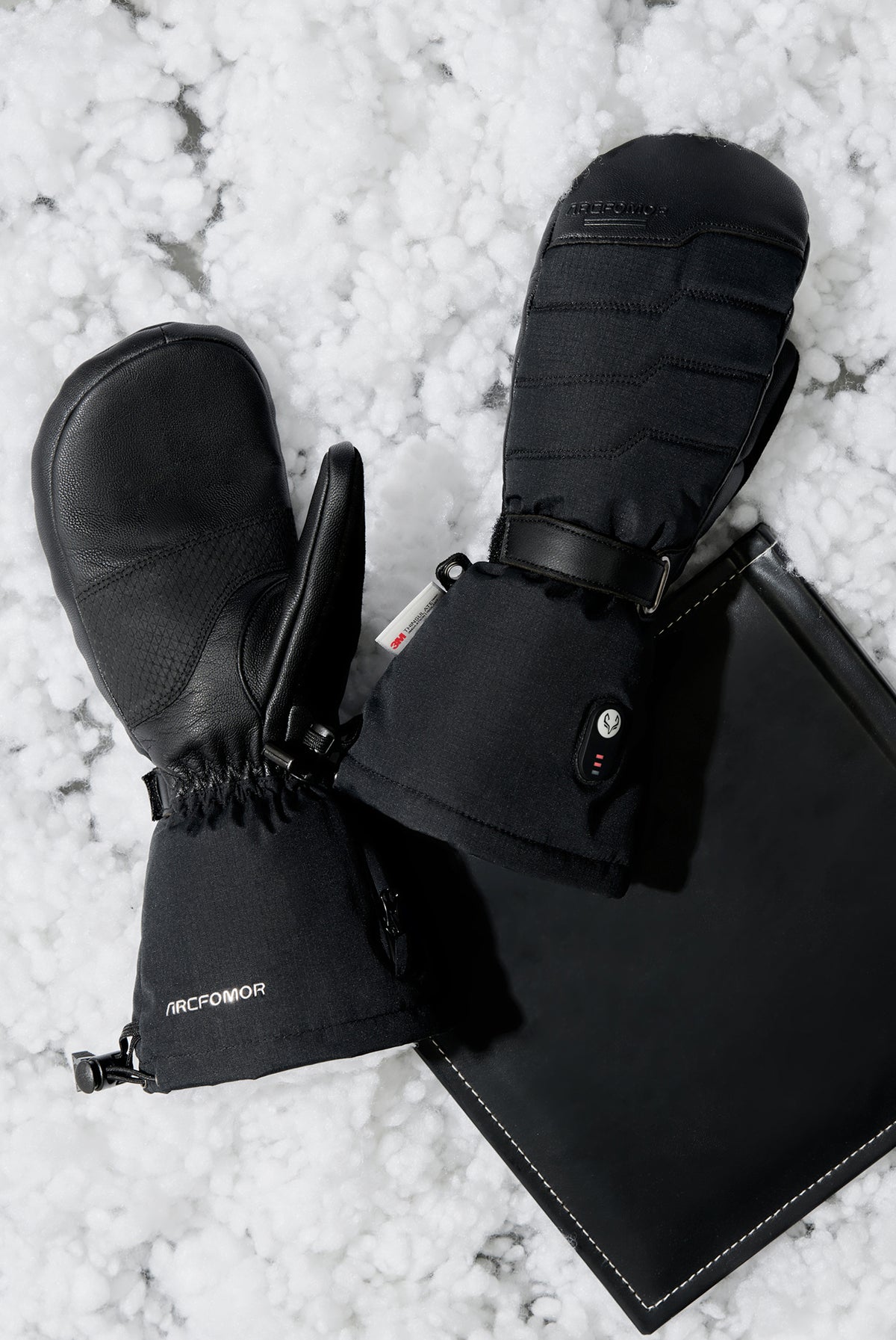 Close-up of Niagara Stone heated mittens worn outdoors in snow