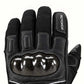 Close-up of the carbon-fiber knuckle shell, stitched leather finger panels and black woven fabric on an Onyx glove.