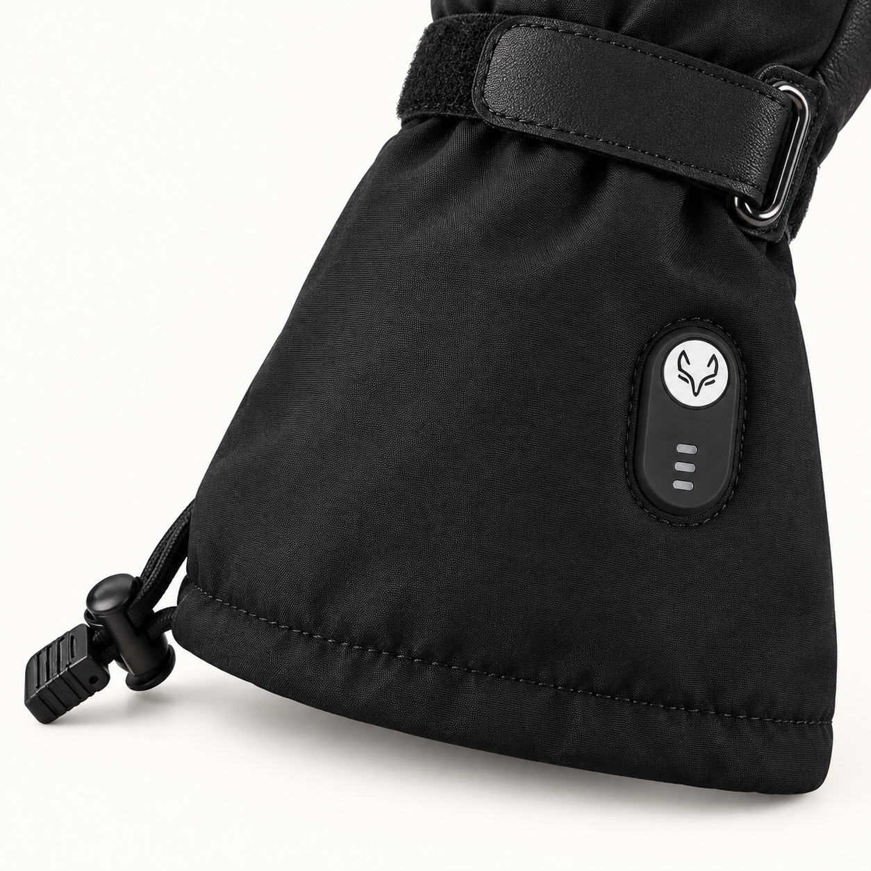Close-up of an Ottawa Nights glove cuff showing the heat control button, three indicator bars and drawcord adjustment.