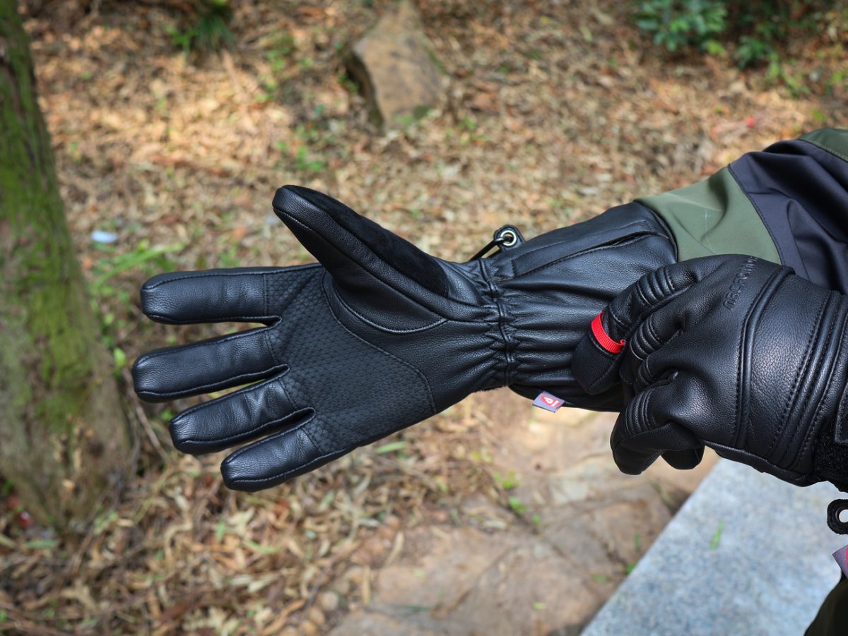 Close-up of the reinforced palm on Polar Baron heated gloves worn outdoors