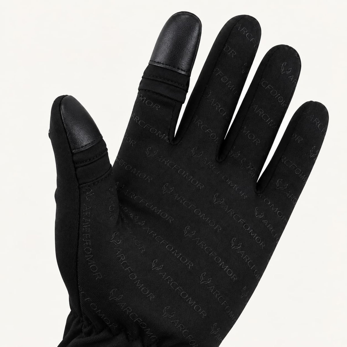 Palm of a Spider Silk glove showing the closed thumb and index finger covers and patterned silicone grip.