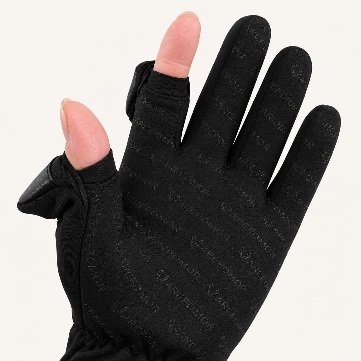 Spider Silk glove with the thumb and index finger covers folded back to expose the fingertips.