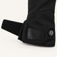 Open adjustable wrist strap and round heat control button on a Spider Silk heated glove.