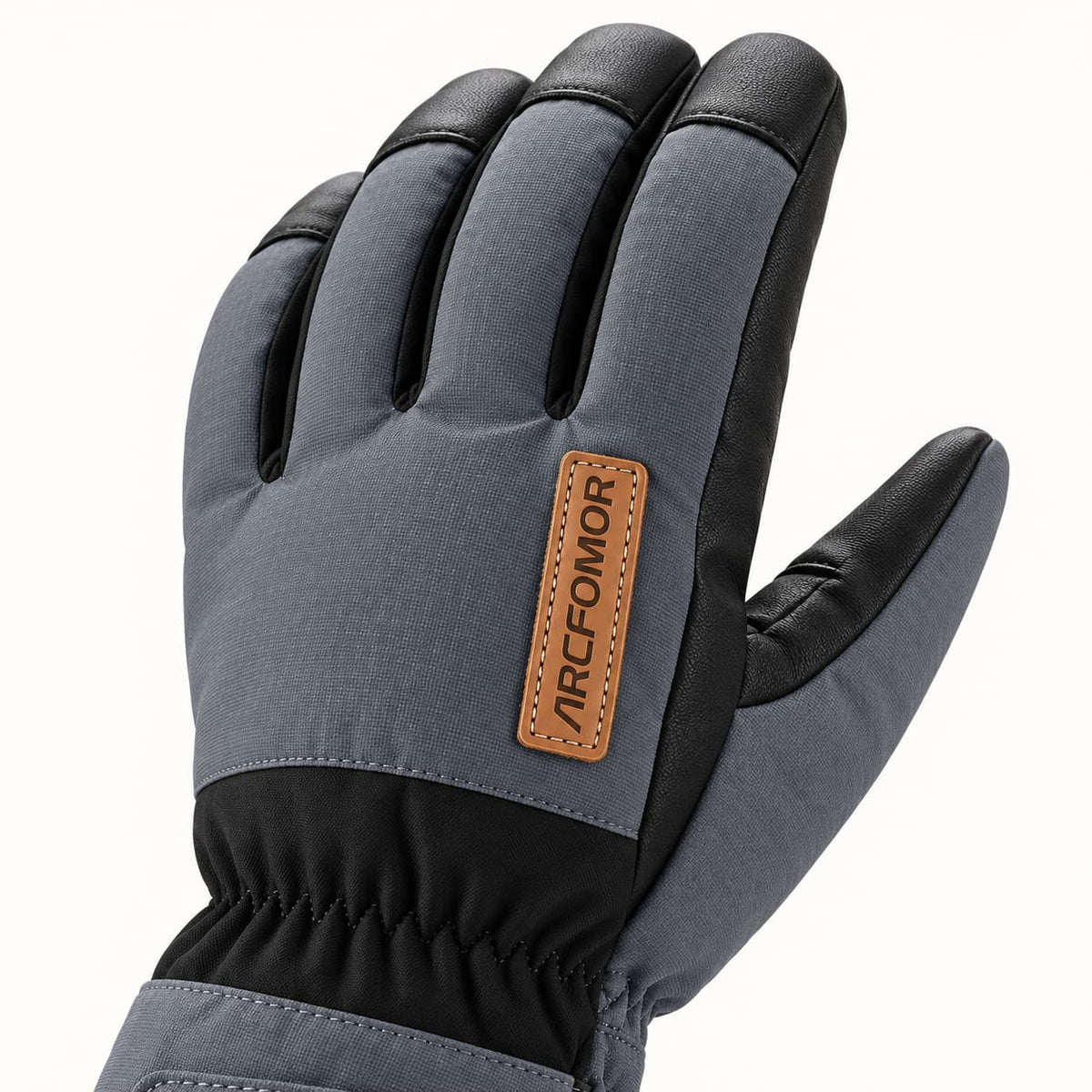 Gray woven back of a Kunlun glove with black PU fingertip caps and a tan stitched Arcfomor brand patch.