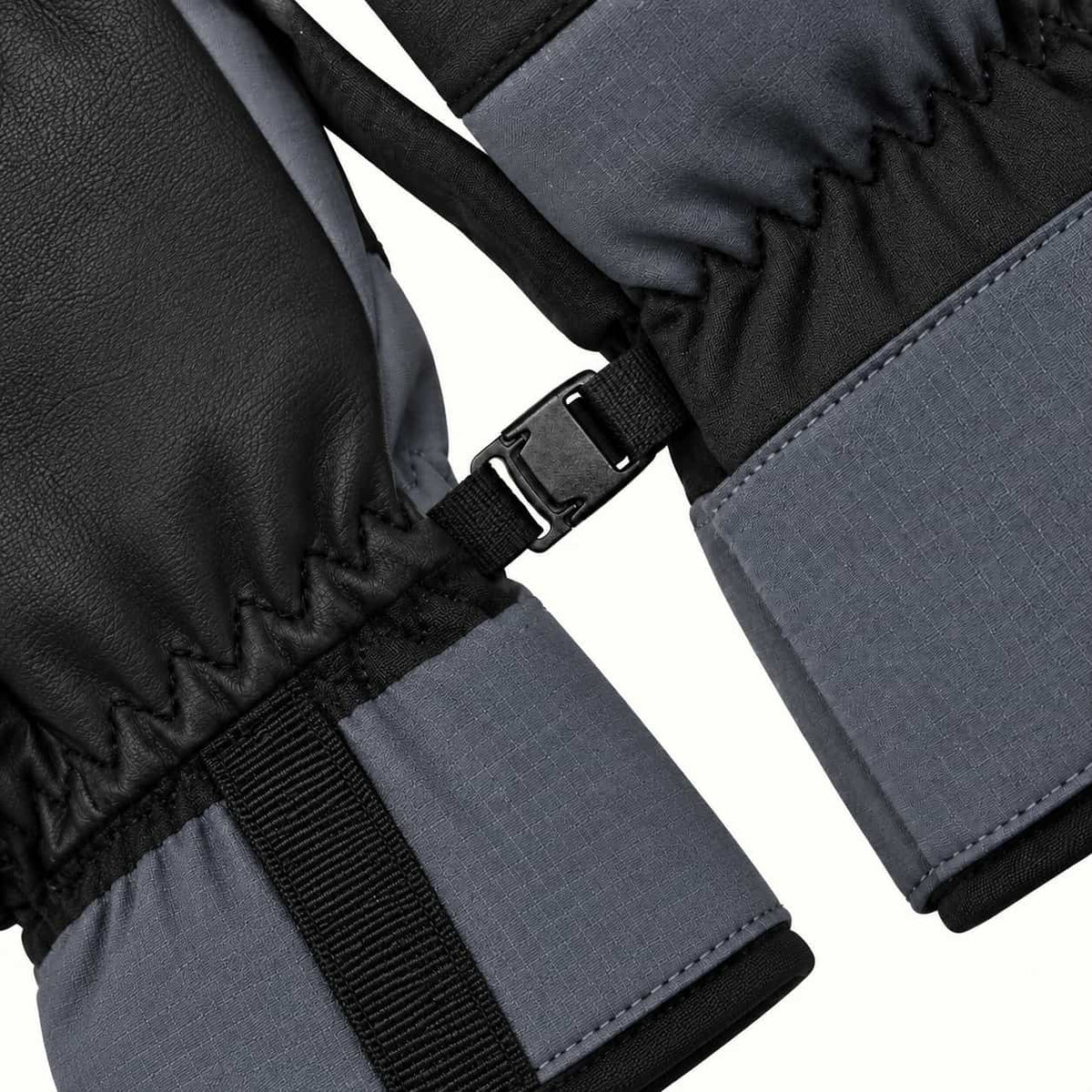 Small black pairing buckle joining two Kunlun glove wrists, with gray cuffs and black webbing visible.
