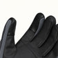 Close-up of a Kunlun glove’s black PU palm, showing the stitched touchscreen patches on the thumb and index fingertip.
