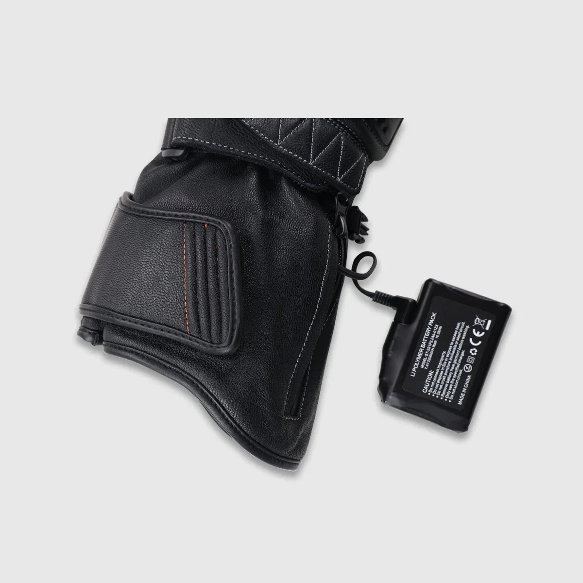 Tempest glove cuff opened to show the 7.4V battery connection and battery compartment