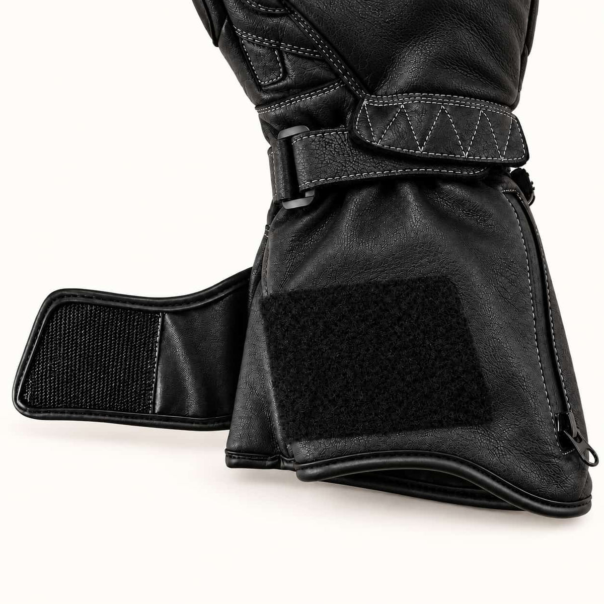 Open hook-and-loop gauntlet closure and adjustable wrist strap on a Tempest heated motorcycle glove.