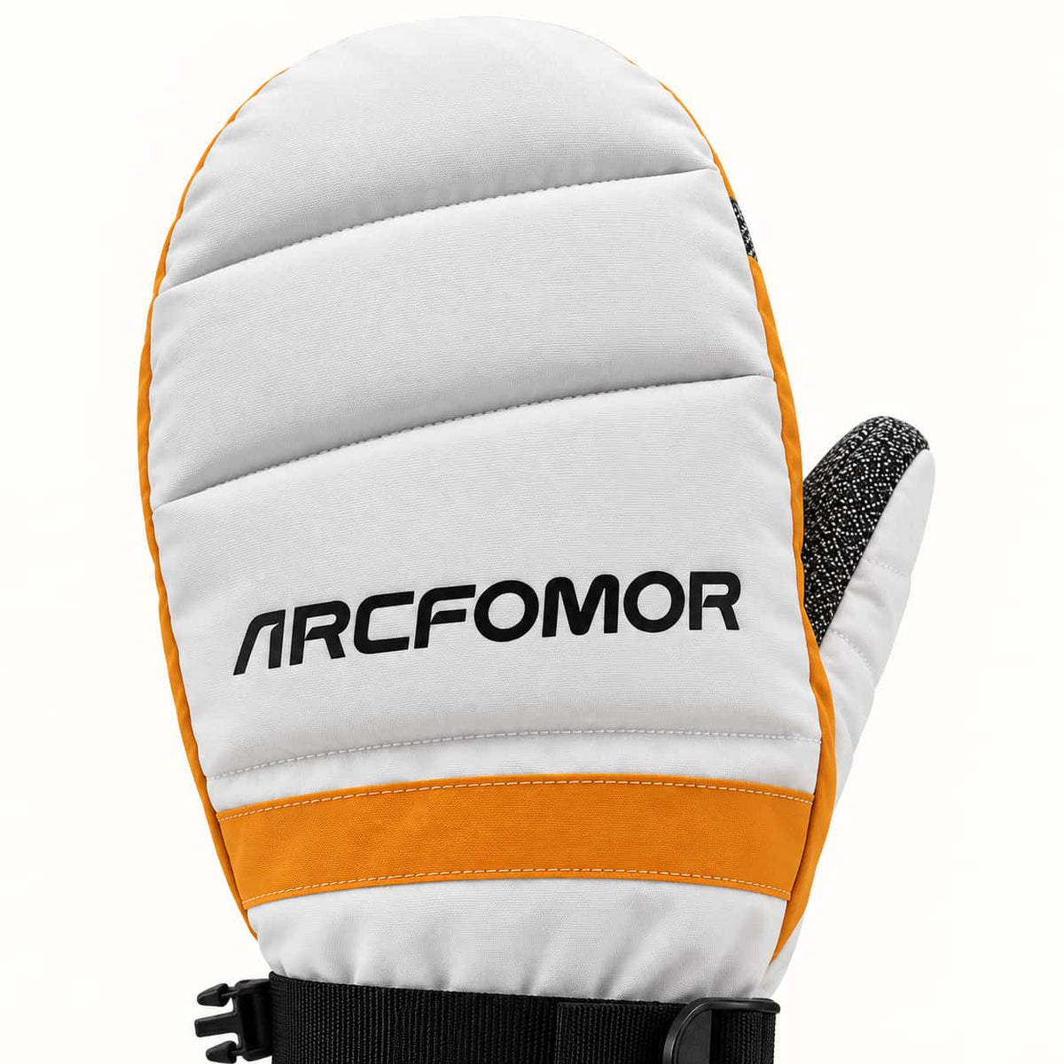 Close-up of the Toboggan mitten's white quilted back, black Arcfomor wordmark and orange accent band.