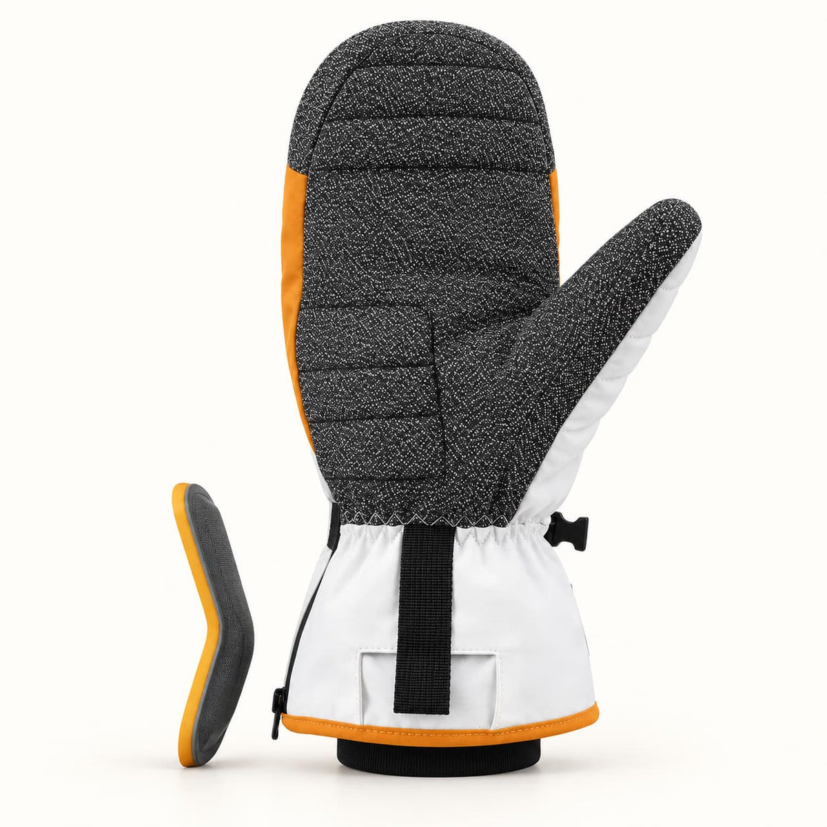 Toboggan heated mitten shown palm-side up beside its removable curved gray palm guard with an orange edge.