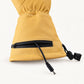 Open zippered cuff battery pocket on a yellow Vellum 2.0 glove, with the power cable and barrel connector visible.