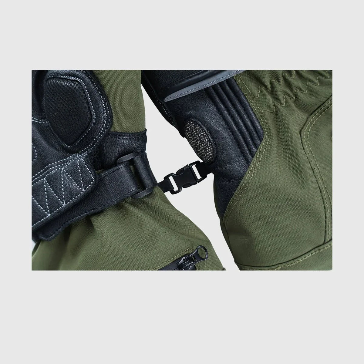 Close-up of the pairing clip and extended cuff on Vortex heated motorcycle gloves