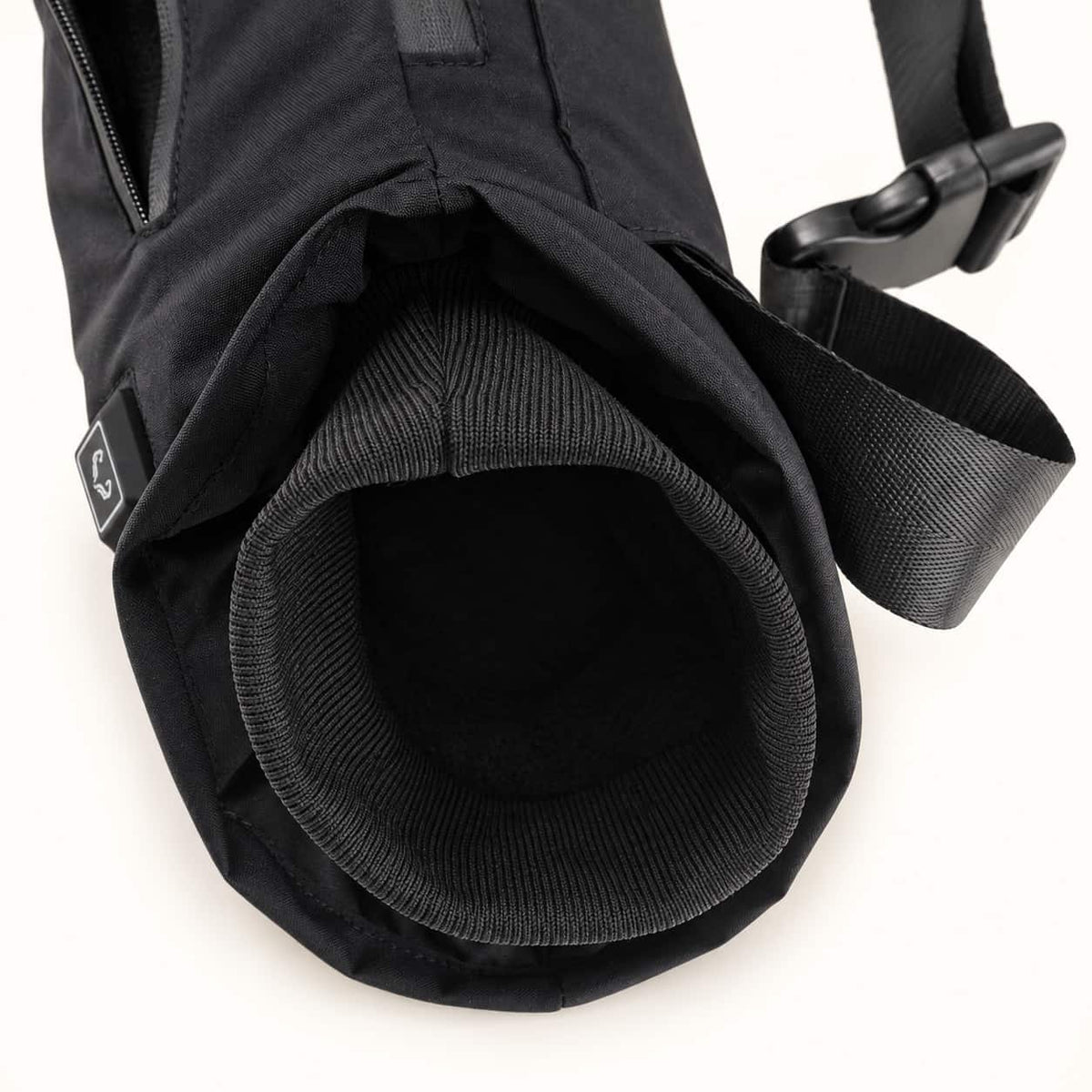 Close-up of the WarmHeart muff’s rib-knit hand opening, showing its black lining and padded outer rim.