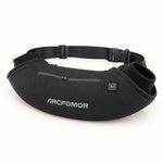 Black Arcfomor WarmHeart heated hand warmer muff with a rib-knit hand opening, front zip pocket and adjustable waist belt.