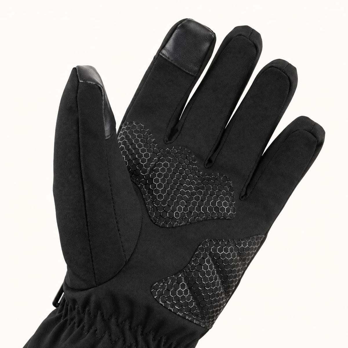 Close-up of the WinterGlow palm with honeycomb grip patches and touchscreen patches on the thumb and index fingertip.