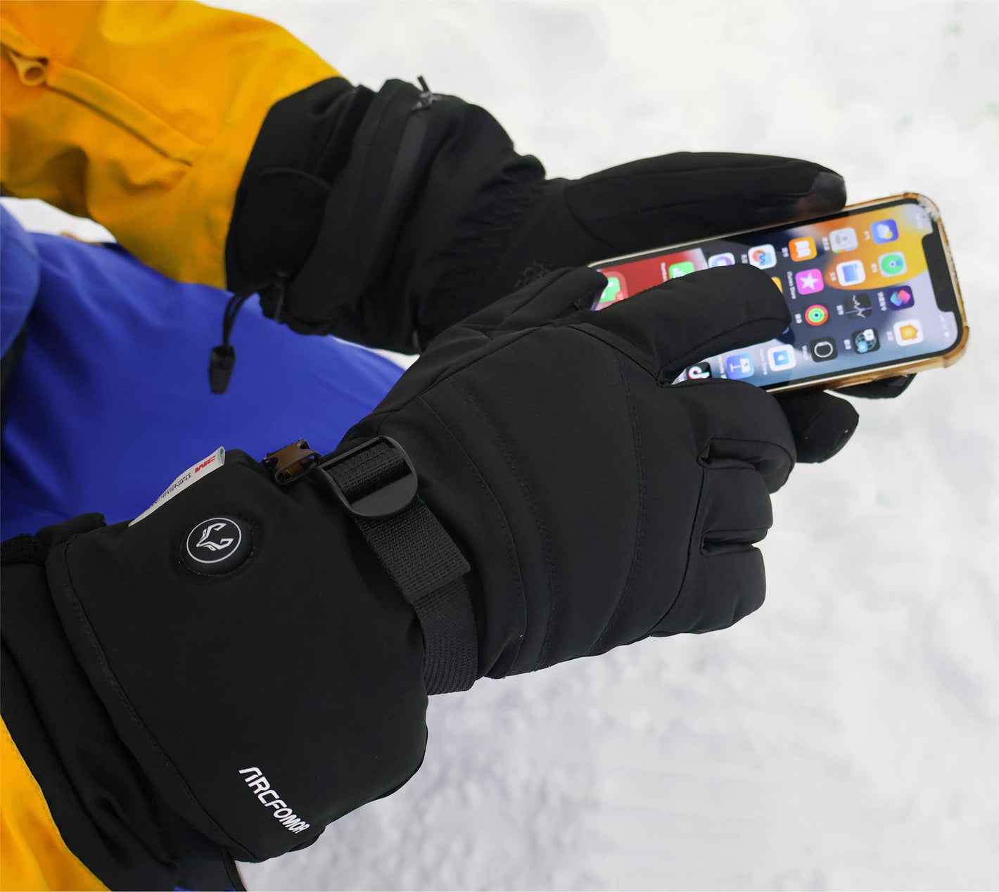 Using a smartphone in the snow with WinterGlow touchscreen heated gloves