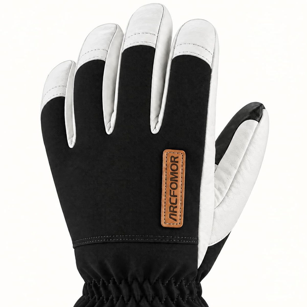 Back of a black Yellowstone glove showing woven fabric, white leather fingertip caps and a tan Arcfomor brand patch.